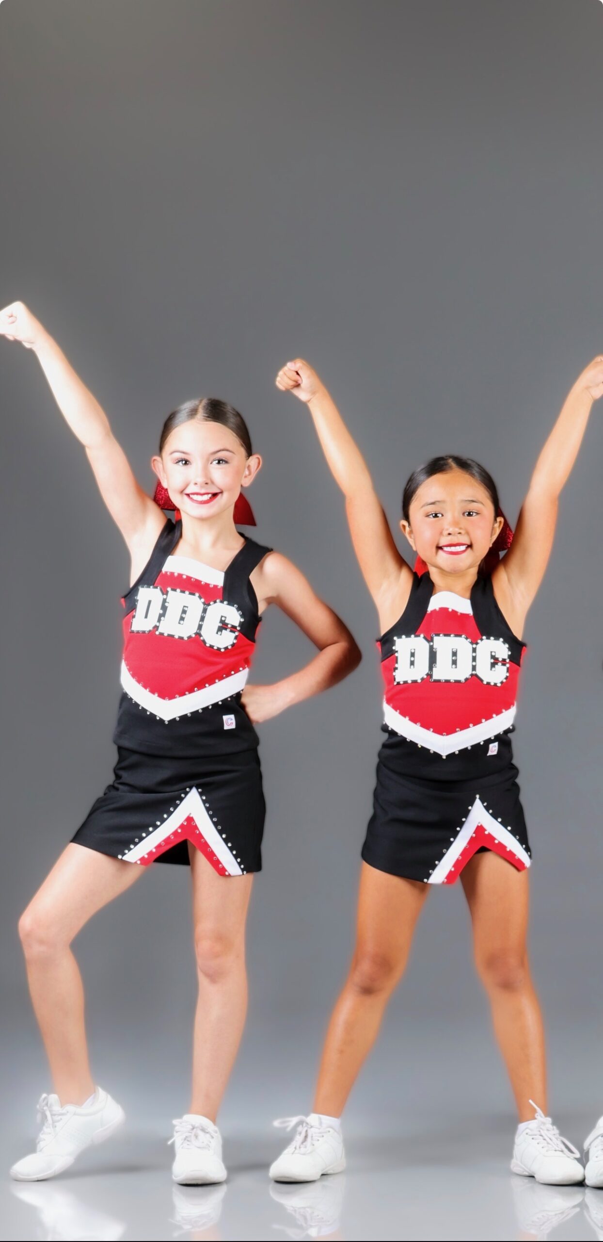 Cheer Students Modeling Cheer Uniforms